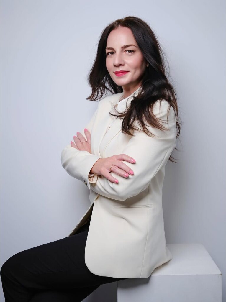 Professional business portrait of a woman in a white blazer by ShotsByDeen