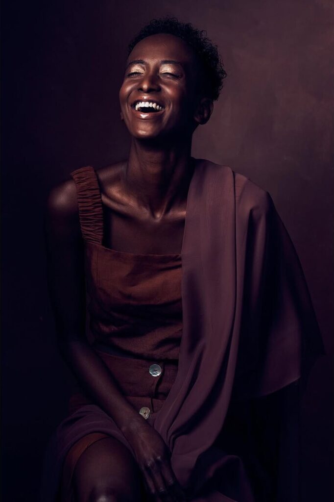 Joyful studio portrait of a woman by ShotsByDeen
