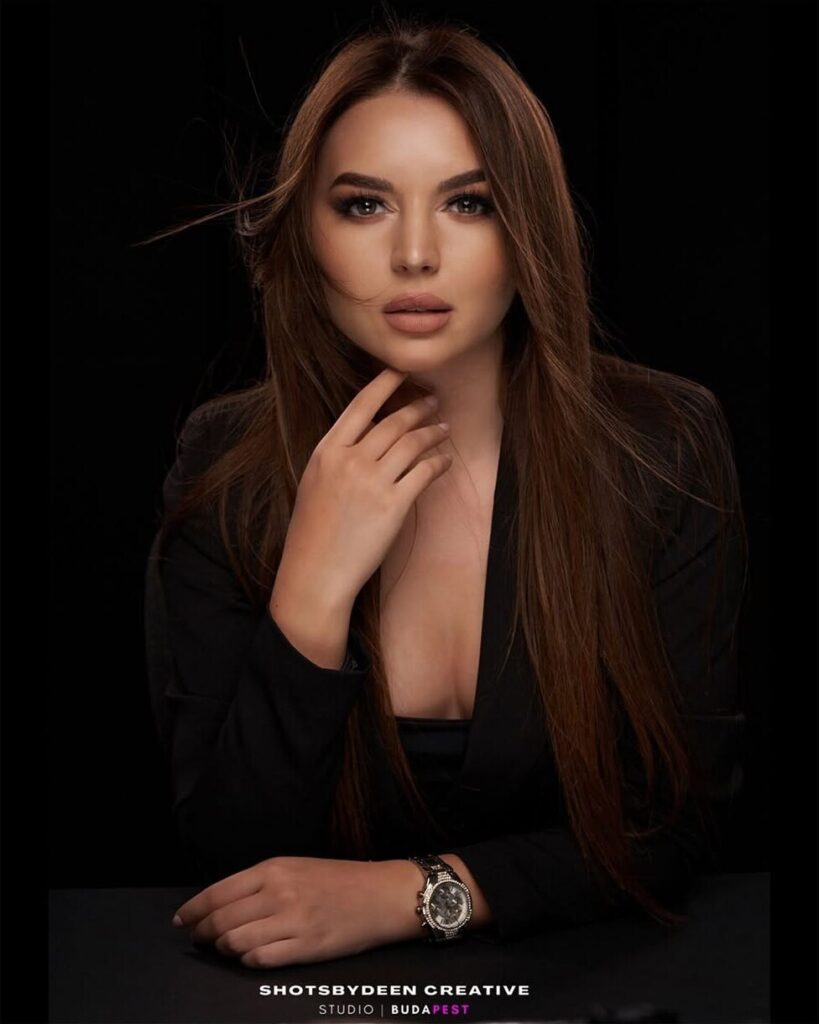 Professional headshot of a woman in a black blazer by ShotsByDeen