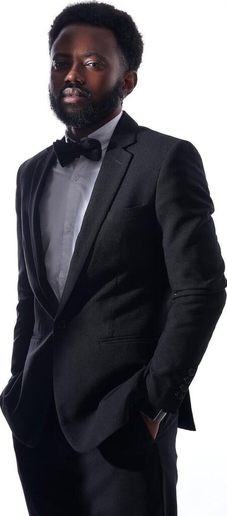 Studio portrait of a man in a tuxedo by ShotsByDeen
